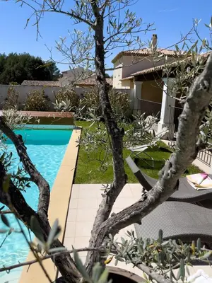 a swimming pool in front of a house at Ma villa en Provence villa de standing et piscine Domaine de Pont-Royal in Mallemort