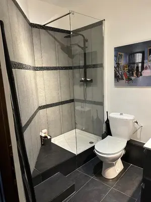 a bathroom with a shower and a toilet at Chambre privée dans un MAS au centre du Village in Maubec