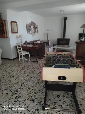 a living room with a large chess board on a table at La maison de Nazig in Pertuis