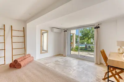 a living room with a table and a desk at Le mas sous les étoiles in Joucas
