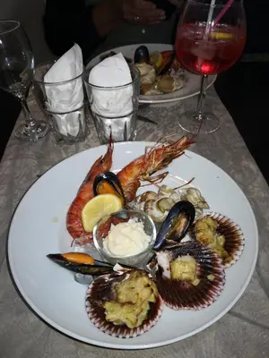 a plate of seafood and oysters on a table at GÎTE DE L 'OCRE NICE VIEW in Villars