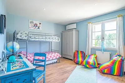 a bedroom with a bunk bed and a desk at Villa des Fontaines luxury family home with pool in Pernes-les-Fontaines