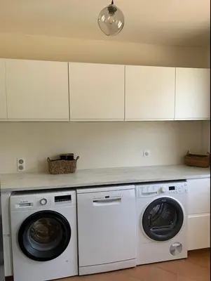 a kitchen with two washer and dryer at Jolie maison avec vue imprenable, piscine, jeu de boules, calme au cœur du Luberon in Les Cordiers