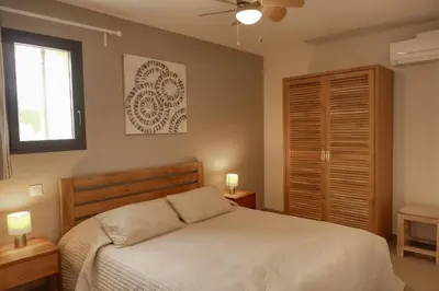 a bedroom with a bed and a window at Souleia in Oppède