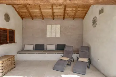 a room with a couch and chairs in it at Souleia in Oppède