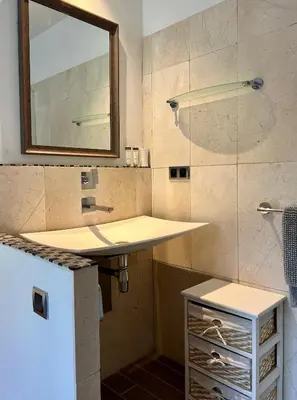 a bathroom with a sink and a mirror at Gîte Nature en Luberon in Céreste