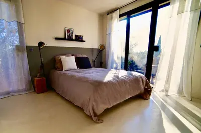 a small wooden cabin in the middle of a forest at La Matina Family Haven with Olive Garden Oasis in Lauris