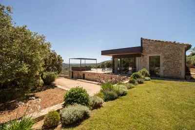 a stone house with a garden and a gazebo at Villa Mirage luxury and design in Bonnieux in Bonnieux