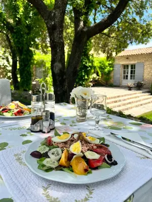 a table with a plate of food on a table at Villa Hautvallon - Peaceful Escape in Provence in Gordes