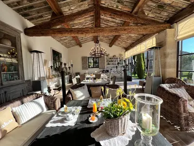 a living room with a table and chairs at Villa Hautvallon - Peaceful Escape in Provence in Gordes