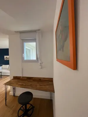 a room with a wooden table and a window at Les appartements du Clos de la Chartreuse By Ateya in Aix-en-Provence
