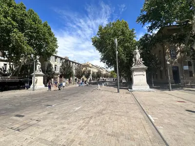 a fountain with a statue in the middle of a park at Charmant studio centre historique stationnement à proximité in Aix-en-Provence