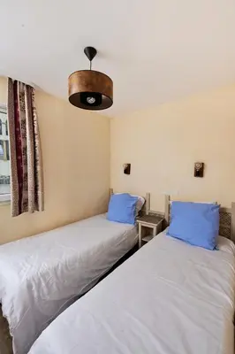 two beds sitting next to each other in a room at Bastidon Golf de Pont Royal in Mallemort