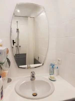 a bathroom with a sink and a mirror at Charmante villa 4 chambres, piscine et superbe vue in Éguilles