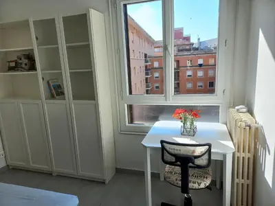 a room with a table and a window and a chair at Aix en Provence - Rotonde - Cours Mirabeau in Aix-en-Provence