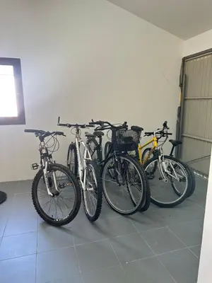 a group of bikes parked in a room at Les Lauriers Blancs air-conditioned villa with swimming pool in LʼIsle-sur-la-Sorgue