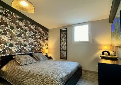 a bedroom with a large bed and a window at B&B 2 Chambres d'hôtes Gai Félibre avec Piscine et Jacuzzi in Le Thor