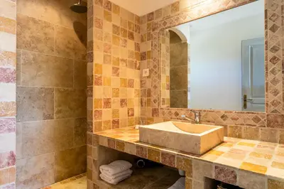 a bathroom with a sink and a mirror at Mas Saint Julien in Cavaillon