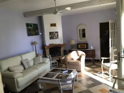 a living room with a couch and a table at FLC - Large Charming House - Swimming Pool in Lambesc