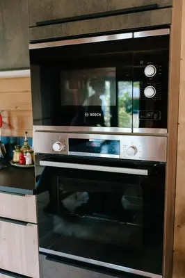 a microwave oven sitting inside of a kitchen at Charming ecolodge with private access to the river in Le Thor