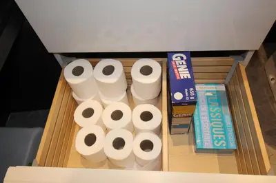 a wooden box filled with rolls of toilet paper at Studio centre historique derrière rue d'Italie - Climatisé in Aix-en-Provence