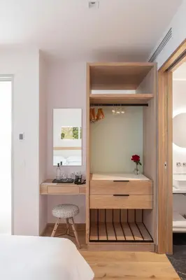 a bedroom with a desk and a bed at Auberge La Coste in Le Puy-Sainte-Réparade