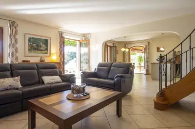 a living room with a couch and a table at Mas de Lavande in Saint-Rémy-de-Provence