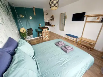a bedroom with a large bed in a room at 104 Douce Provence au calme face à la piscine in Éguilles