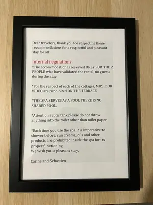 a picture of a document in a frame on a wall at Pause spa sur la route du Ventoux adults only in Carpentras