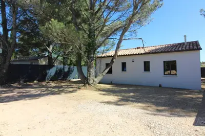 a white house with a tree in front of it at Pause spa sur la route du Ventoux adults only in Carpentras