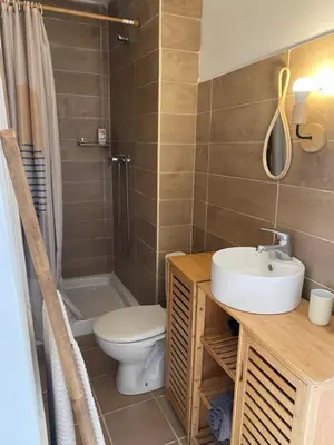 a bathroom with a sink and a toilet and a shower at La studette provençale in Jouques