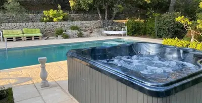 a swimming pool with a jacuzziificialificialificialificialificialificialificial at La studette provençale in Jouques