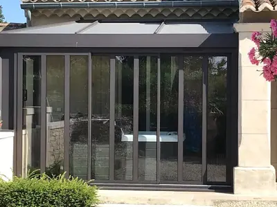 a sliding glass door with bars on a house at Lou Mas dou Souleou & Spa in Cheval-Blanc