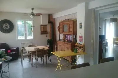 a kitchen and dining room with a table and chairs at Au goût du miel. Luberon-Provence. in Maubec