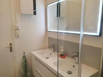 a bathroom with a sink and a glass shower at Villa Tassigny in Aix-en-Provence
