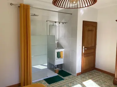 a bathroom with a shower with a glass door at Domaine des Lavarines in Morières-lès-Avignon