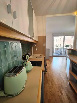 a kitchen with a stove and a counter top at Terrasse & Spa dans Aix Hypercentre in Aix-en-Provence