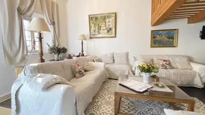 a living room with two couches and a fireplace at Mas de Veroncle, piscine et quiétude à Gordes in Gordes