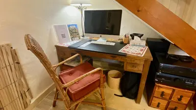 an office with a desk with a computer on it at Mas de Veroncle, piscine et quiétude à Gordes in Gordes