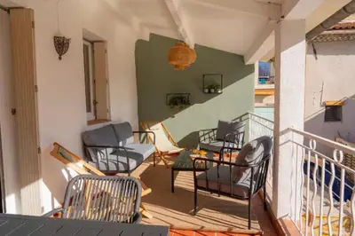 a balcony with chairs and a table at Deux chambres avec terrasse dans le centre ville d'Aix en Provence in Aix-en-Provence