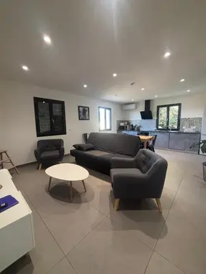 a living room with a couch and two chairs and a table at Appartement neuf Bédoin - Les Cinglés du Mont Ventoux in Mormoiron
