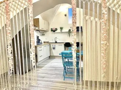 a kitchen and dining room with a blue table at *Le Lotus*Fiber Wifi*Hyper Center* in Salon-de-Provence