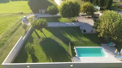 an overhead view of a large yard with a swimming pool at Le Petit Mas Rey in Eyragues