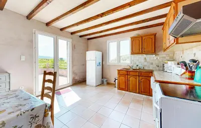 a kitchen with wooden cabinets and a white refrigerator at 3 Bedroom Stunning Home In Bédoin in Bédoin