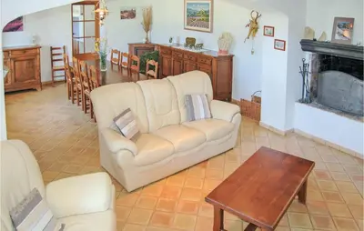 a living room with a couch and a table at Amazing Home In Sainte Croix-À-Lauze in Sainte-Croix-à-Lauze
