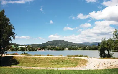 a view of a lake with mountains in the background at Amazing Home In St Martin De Castillon in Saint-Martin-de-Castillon