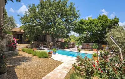a backyard with a swimming pool and trees at Amazing Home In St Martin De Castillon in Saint-Martin-de-Castillon