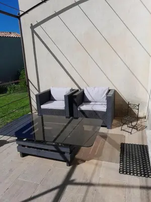 a couple of chairs sitting on a patio at Sud luberon in Ansouis
