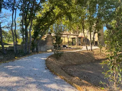 a house with a walkway in front of a yard at Havre de paix au sein d'un T3 d'une bastide aixoise in Aix-en-Provence
