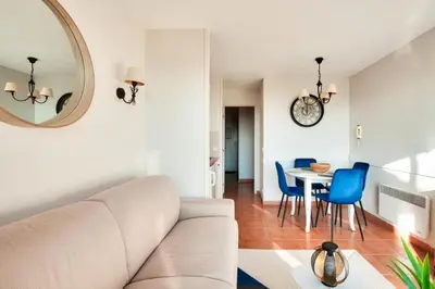 a living room with a couch and a table at Village Pont Royal en Provence - maeva Home - Appartement climatisé 2 pièces 4 personnes - Sélection MAE-2601 in Mallemort
